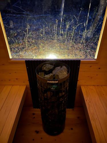 a trash can sitting on a table in front of a window at Nasu Sauna Stay in Nasu