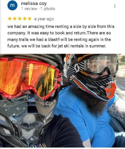 a person wearing a helmet and goggles on a motorcycle at Stabbin Cabin #2 on Grant Island - Hot Tub, Boat, Pet Friendly in Glenfield