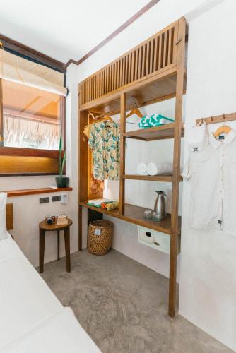 a bedroom with a bunk bed and a bed at Bravo Beach Resort in General Luna