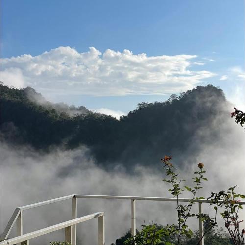 a view of a mountain obscured by clouds at ViewNaaBaan At Phamee in Ban Pha Mi