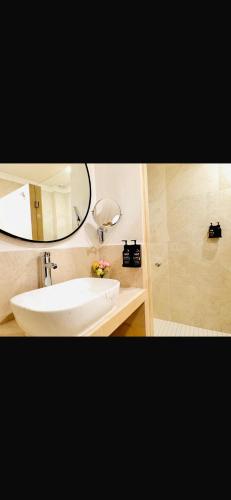 a bathroom with a sink and a mirror at Hotel Casa KARLOTTA in San Miguel de Allende