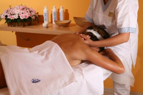 a woman getting a massage in a towel at Grand Hotel Terme in Margherita di Savoia