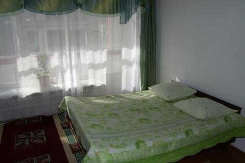 Katil atau katil-katil dalam bilik di Otel Issyk-Kul Karakol
