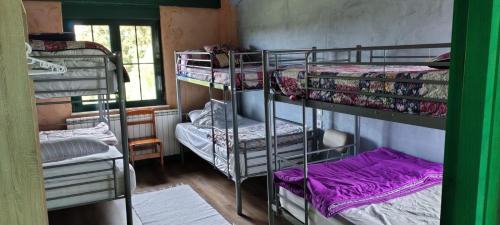 Postel nebo postele na pokoji v ubytování ALBERGUE peregrinos CASAFLOR
