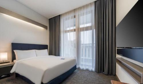 Кровать или кровати в номере Busan Haeundae Beach Ocean View Terrace Hotel