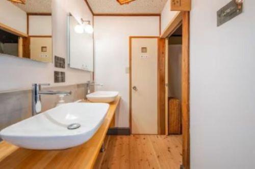 a bathroom with a white sink and a toilet at Guesthouse giwa - Vacation STAY 14271v in Mishima