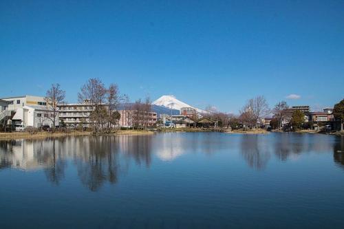 a large body of water with a mountain in the background at Guesthouse giwa - Vacation STAY 14271v in Mishima