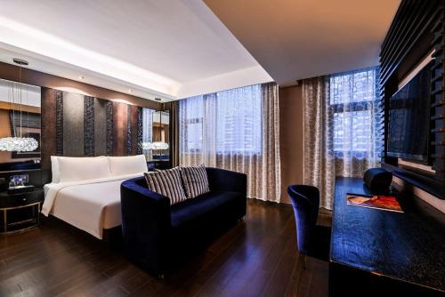 Postel nebo postele na pokoji v ubytování 上海北外滩桔子水晶酒店