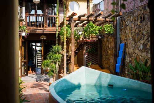 a bath tub in the middle of a building at Hoi An Hidden Boat in Hoi An