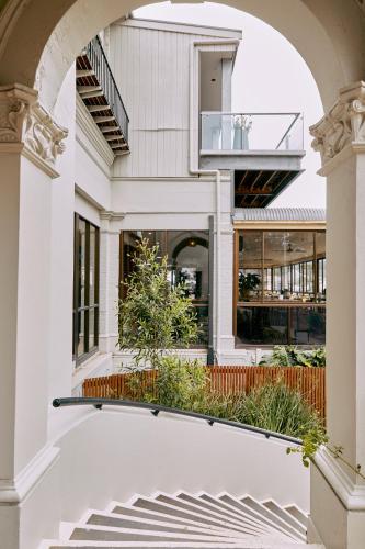 an external view of a house with an archway at Lorne Hotel in Lorne