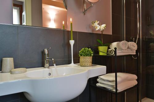 a bathroom with a sink and a mirror at Casa dei Racconti in Ceggia