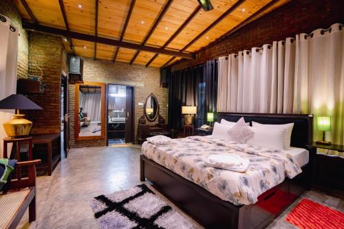 a bedroom with a large bed in a room at Aayu Hanthana Boutique Hotel in Kandy