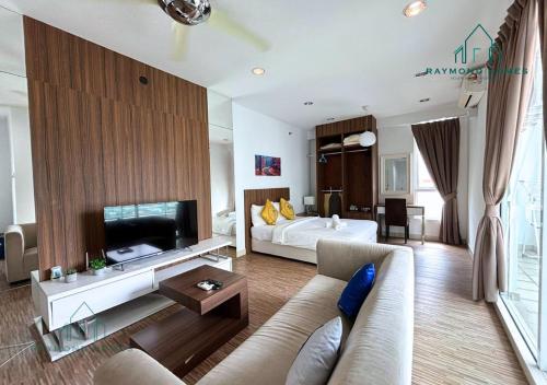 a large living room with a bed and a couch at Gurney Drive Mansion One Serviced Apartment in George Town