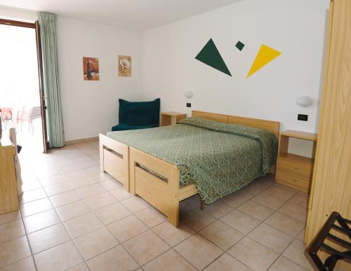 A bed or beds in a room at Hotel San Remo