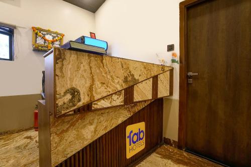 a staircase in a room next to a door at FabExpress Malali Residency in Mumbai
