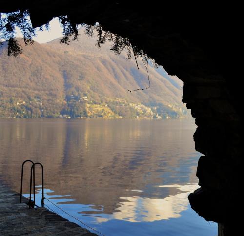 a view of a body of water with a mountain at Appartamento Country House Menaggio in Menaggio