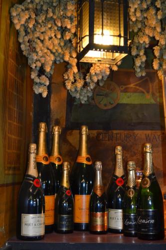 a group of bottles of wine sitting on a shelf at Mermaid Inn in Rye