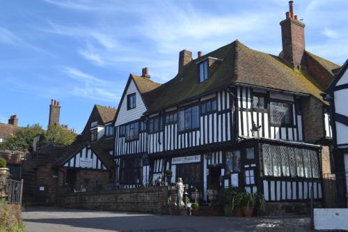 an old building with black and white timbered at Mermaid Inn in Rye