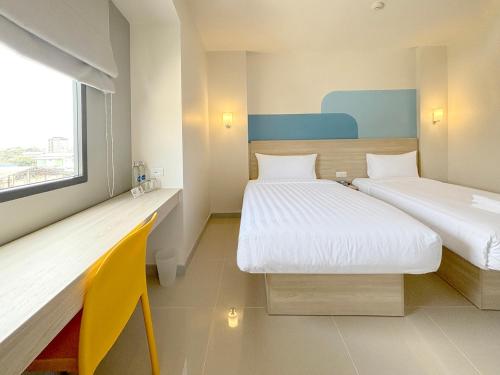 Katil atau katil-katil dalam bilik di HOP INN Khon Kaen Maliwan Road