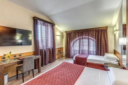 Ένα ή περισσότερα κρεβάτια σε δωμάτιο στο Kolbe Hotel Rome