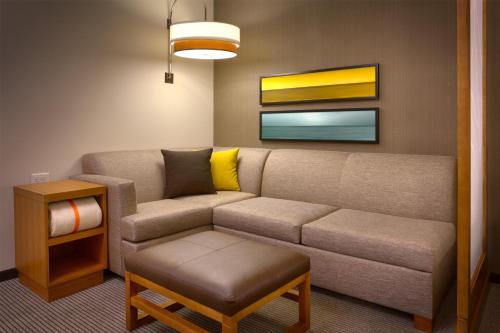 a living room with a couch and a table at Hyatt Place Park City in Park City