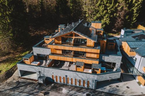an aerial view of a large house with many windows at Das Goldjuwel - Luxury Apartments with private Spa in Goldegg