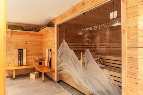 a wooden room with a sauna with a window at Studio Hochzillertal mit Sauna in Ried im Zillertal