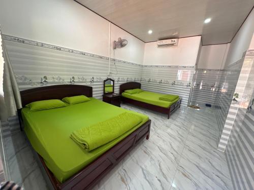 Letto o letti in una camera di Nhà Nghỉ Thuỳ Duyên