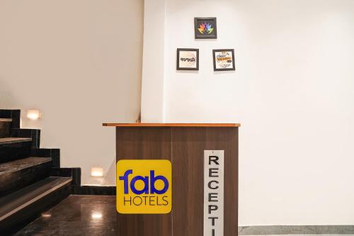 a lectern in a room with a fico hotel sign at FabHotel The Shivaay Palace in Varanasi
