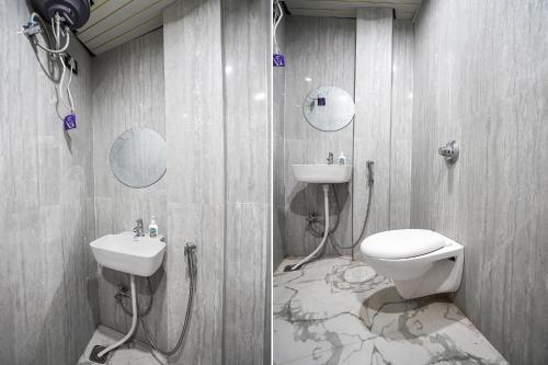 a bathroom with a toilet and a sink at FabHotel The Shivaay Palace in Varanasi