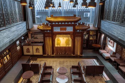 an overhead view of a building with a stage at Beijing Shichahai Shadow Art Performance Courtyard in Beijing