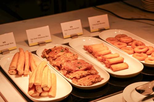 a buffet of different types of food on a table at The Westin Wuhan Hanyang in Wuhan