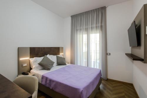 Postel nebo postele na pokoji v ubytování Hotel Casa Tra Noi