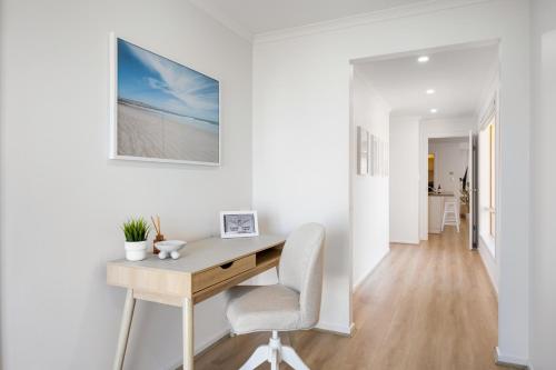 a white office with a desk and a chair at Halcyon Haven in Aldinga Beach