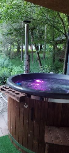 a hot tub with a purple top in a yard at Penzion Zázrifka in Zázrivá