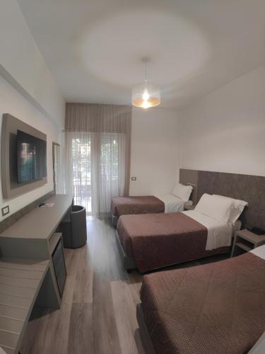 Postel nebo postele na pokoji v ubytování Hotel Casa Tra Noi