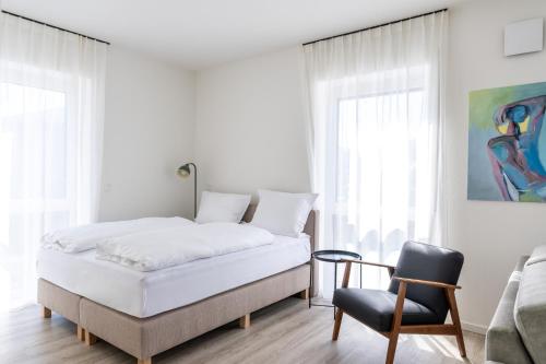 Ένα ή περισσότερα κρεβάτια σε δωμάτιο στο Suites Visbek, 24h Self Check In