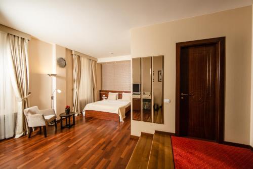 Passage Luxury Rooms Hotelにあるベッド