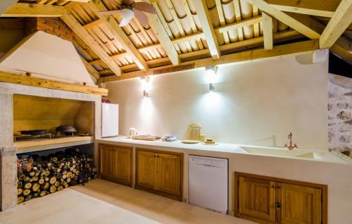 a kitchen with wooden cabinets and a counter top at Villa Blue by Villas Guide in Dubrovnik