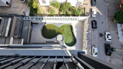 a green garden on the side of a building at Elite Luxury Suite - Elize 4 in Alanya