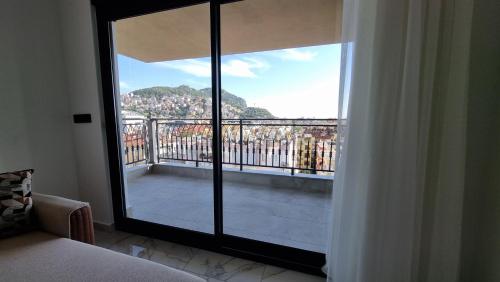 a room with a large glass door to a balcony at Elite Luxury Suite - Elize 4 in Alanya