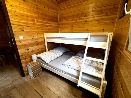 Postel nebo postele na pokoji v ubytování Lubkowa chata