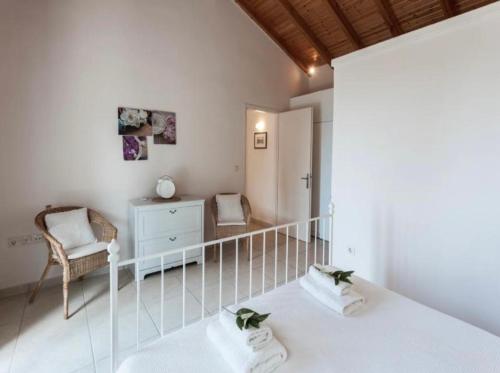 Ένα ή περισσότερα κρεβάτια σε δωμάτιο στο Villa Daphne