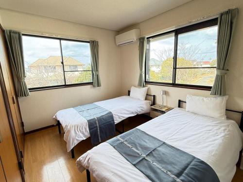 Ένα ή περισσότερα κρεβάτια σε δωμάτιο στο azabu living