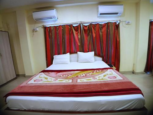 Ein Bett oder Betten in einem Zimmer der Unterkunft Hotel Sea Coast