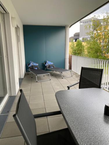 a balcony with tables and chairs on a building at Ebelsberger Terrassen in Linz