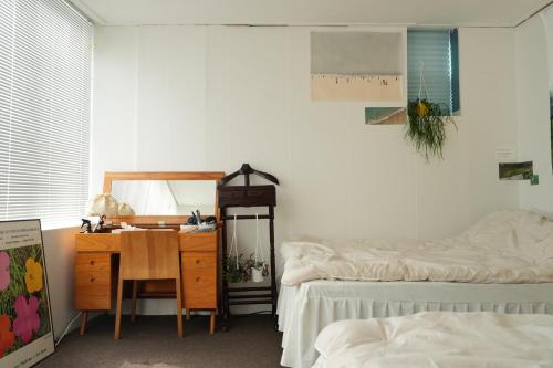 Ένα ή περισσότερα κρεβάτια σε δωμάτιο στο Atelier Vert