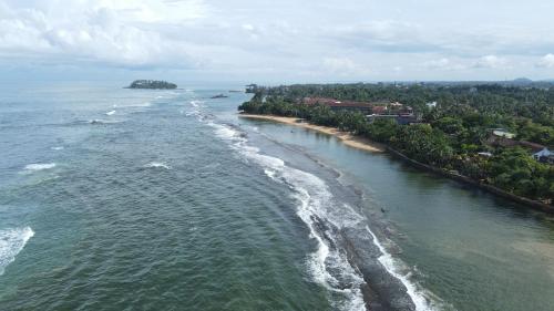 an aerial view of the ocean and a beach at Hotel Coconut Bar Sea Lodge in Beruwala