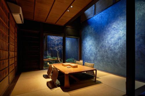a dining room with a table and chairs at YADORU KYOTO HANARE Mizunoe No Yado in Kyoto