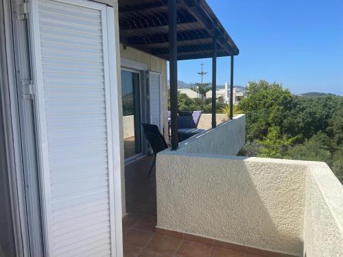a balcony of a house with a view at Carpe Diem in Zipárion